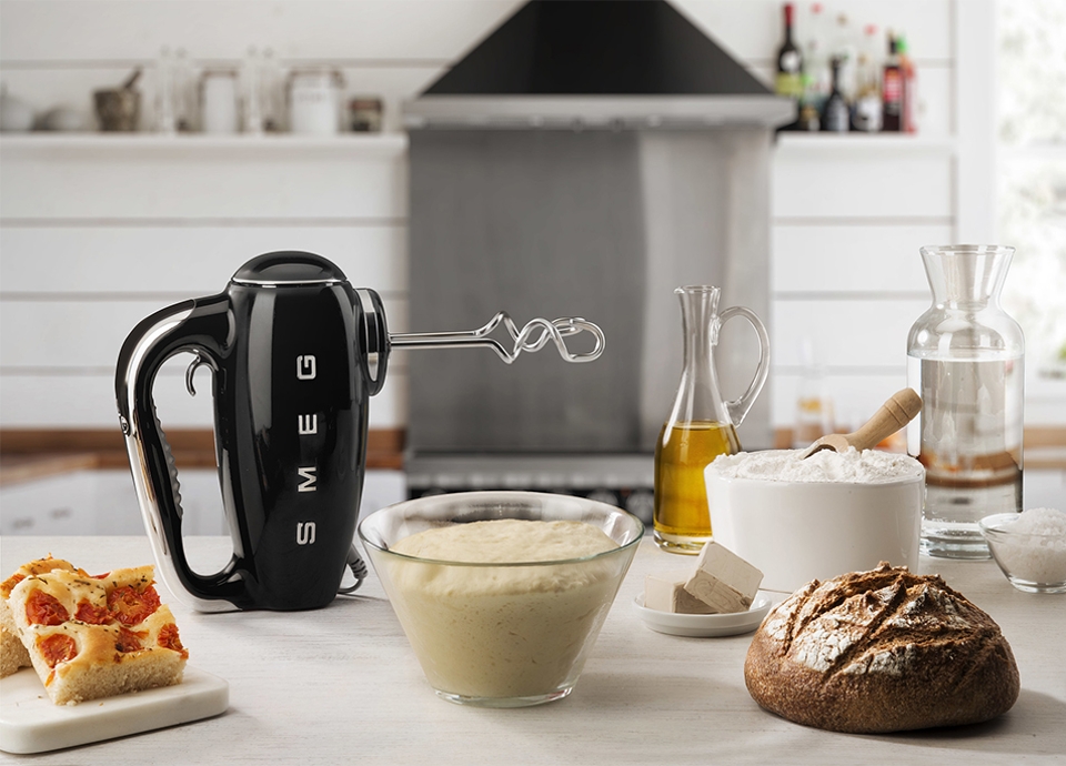 Electric hand mixer in black in a kitchen
